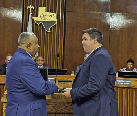 Jorge Vargas is sworn in by Executive Pastor Ryan Irwin of First Baptist Church of Terrell for District 3 on the Terrell City Council alongside his family, friends and members of the Terrell Lions Club. Photo courtesy of City of Terrell