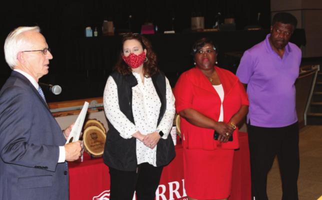 Kaufman County Judge Hal Richards administers the oath of office Monday to recently elected members of the Terrell ISD Board of Trustees. From left are Richards, Trustee Channy Ory, new Trustee Tonya Derrick and Trustee Reginald Pegram. HANK MURPHY PHOTO