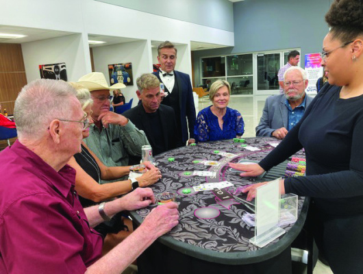 While the games are all in fun, this group of players appears to be very serious about their cards and bets. Photo courtesy of No. 1 BFTS Museum