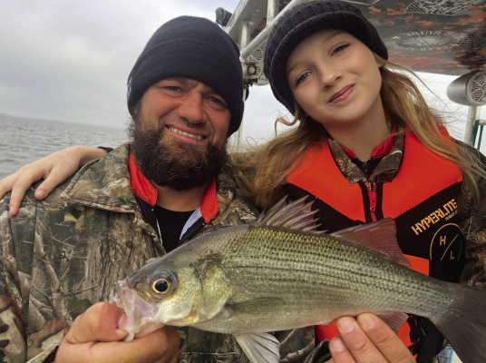 Guide Brandon Sargent with his little “Deck Hand” daughter Brooklyn who is not only cute as a button but also a very experienced angler for someone of her tender years. Photo by Luke Clayton
