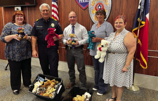 Chief Ken McKeown and Captain Bulin accept a Beanie Babies donation at the Terrell Police Department Advisory Committee meeting courtesy of Morgan Echols. Photos courtesy of Andreia Reese