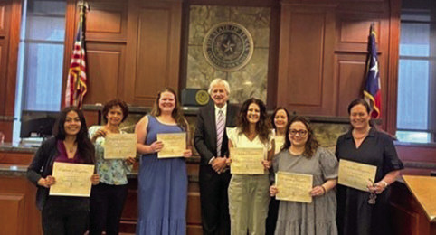 Pictured from left to right: Victoria Henderson, Helping Heart; Betty Christian, Advocate; Ashlyn Cox, Advocate; Judge Brett Hall; Leslie Williams, Advocate; Cheri Grinstead, Advocate; Kim Nielsen, Advocate; and Michelle Scott. Courtesy Photo