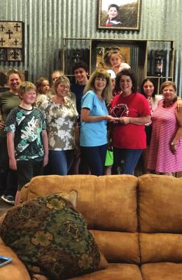 Members of the Jake Wilson Memorial Foundation, Inc. board traveled to Jake E's Riding Round Up in Kaufman for a special donation ceremony and to tour the facilities. Those on hand for the presentation included: Paige Courtney, Makayla Paige, Justice Allie, Elisha Wilson, Joshua Wilson, Dani Allie, Sariah Wilson, Andrew and Jennifer Davidson, Diane Wilson, Jana Ewing Syvrud and Debbie Helm. COURTESY PHOTO