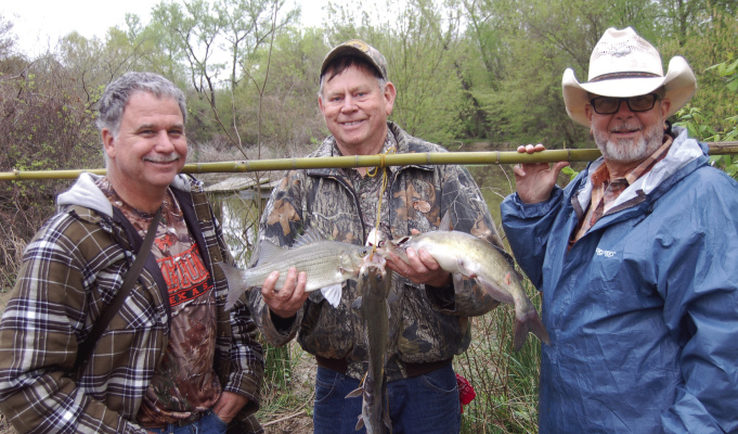 Make sure and bring along plenty of baits. It’s a good bet baits will be lost to submerged brush and possibly overhanging limbs. The white bass spawn is about to break looks in creeks and rivers across the state. Here Luke and buddies show off the makings of a creek side noon fish fry. Courtesy photo