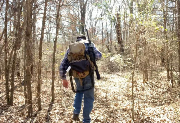 The winter woods provides peace and solitude that is sometimes difficult to find in today’s world. Luke is walking back into a creek bottom in quest of wild hogs. Photo by Luke Clayton