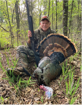 Luke shows off a heavy gobbler he took last week on what he described as a ‘perfect’ day in the outdoors. In today’s column, Luke details the day he spent with his longtime friend, Bill Carey, hunting turkeys, fishing and cooking some very fresh turkey breast fillets. Photo by Bill Carey