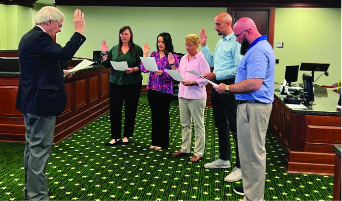 Tanya Tyler, Brittney Franza, Julie Williams, Andrew Comingore and Fred Barker were sworn in as CASA volunteers by 382nd District Court Judge Brett Hall. Courtesy photo