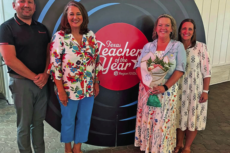 Furlough Middle School teacher Heather Ray (middle, right) was named the Region 10 Teacher of the Year and honored during a Terrell ISD luncheon on Thursday, July 30. See more photos on page Photo courtesy of Terrell ISD