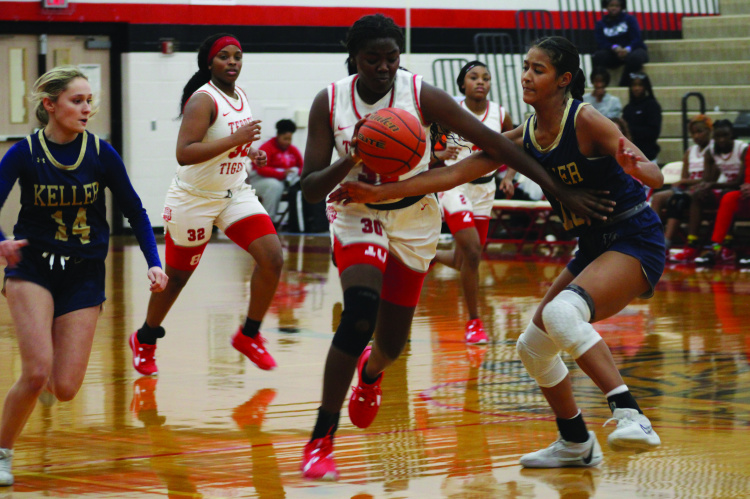 Terrell Lady Tiger Serenity McCullough battles through contact during the second quarter of their home game against the Keller Indians Dec. 5. Photo by Bodey Cooper