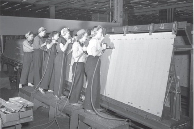 The riveters (note, all women) working on a B-24 wing. Photo courtesy of No. 1 BFTS Museum