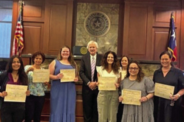 Pictured from left to right: Victoria Henderson, Helping Heart; Betty Christian, Advocate; Ashlyn Cox, Advocate; Judge Brett Hall; Leslie Williams, Advocate; Cheri Grinstead, Advocate; Kim Nielsen, Advocate; and Michelle Scott. Courtesy Photo
