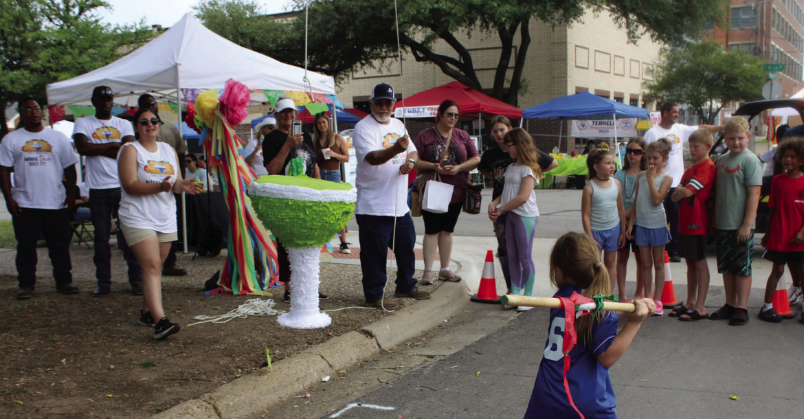 A small child attempts to smash a piñata during the Terrell Taco Festival, which returns to Historic Downtown on Saturday, May 4 from 11 a.m.-4 p.m. Photo courtesy of Terrell Chamber of Commerce