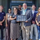 Members of the Terrell Economic Development Corporation and Terrell Chamber of Commerce celebrate closing on the Brin Opera House as the future headquarters of both organizations on July 22. Photo courtesy of Terrell Economic Development Corporation